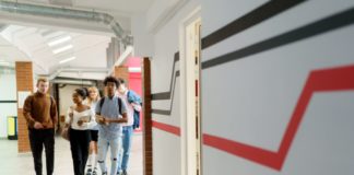 people walking in a hallway.