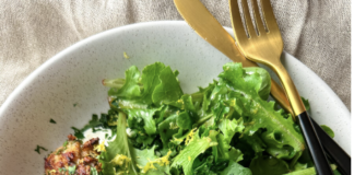 A plate of couscous and some greens.