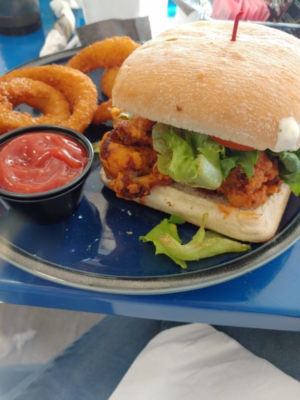 A sandwich and onion rings.
