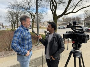 A person interviewing another person.