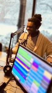 A person being recorded for a radio broadcast.