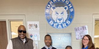 A group of people taking a picture.