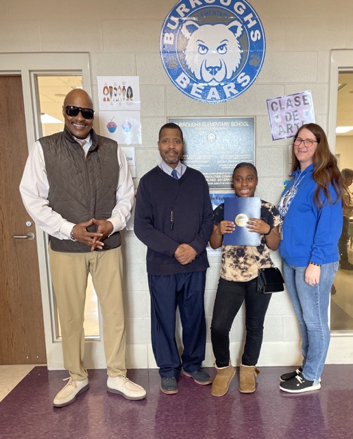 A group of people taking a picture.