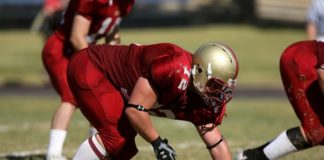 A photo of a football player during a game.