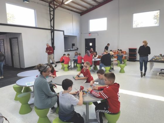 A group of kids working on crafts.