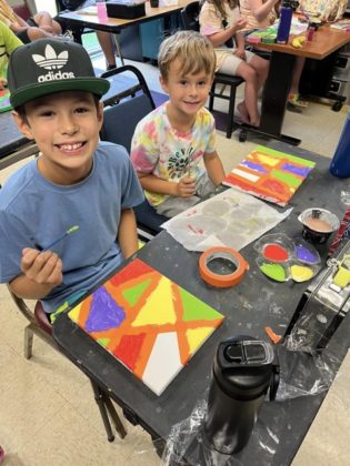 Kids working on arts and crafts.