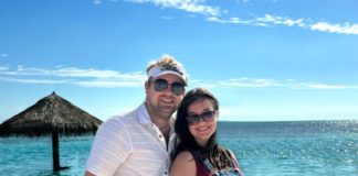 A couple by the beach.