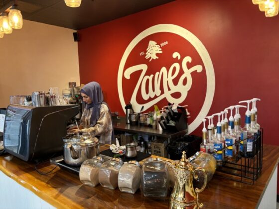 Behind the counter at Zane's.