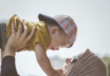 Where to Celebrate Mother’s Day in Toledo 2024 A parent holding a child.