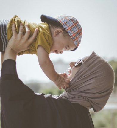 A parent holding a child.