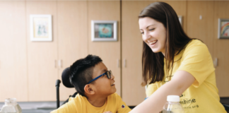 A person talking to a child.