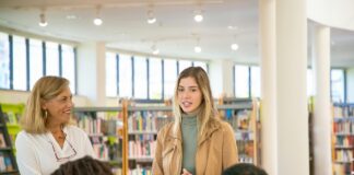 A person talking to a group of people.