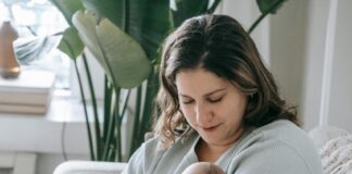 A parent holding their child.