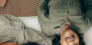 Photo of family smiling up at camera