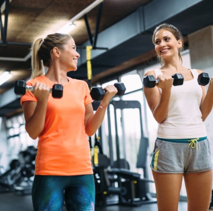 Two people doing curls