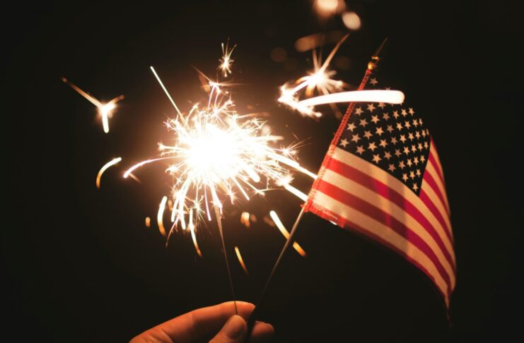 An American flag and a sparkler