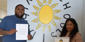 Proudly holding certificates