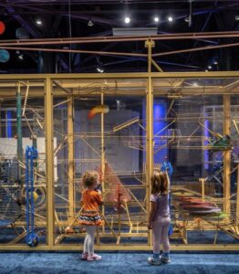 Children participating in an activity at the Imagination Station.