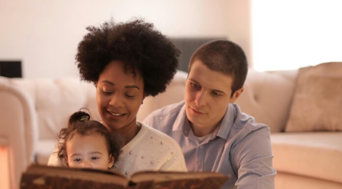 Parents reading with their child.