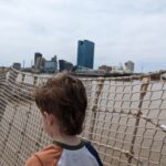 A photo of glass buildings in the background.