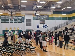 People standing in a gym.