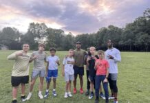 A group of kids taking a picture together.