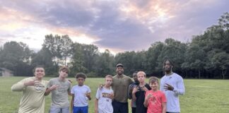 A group of kids taking a picture together.