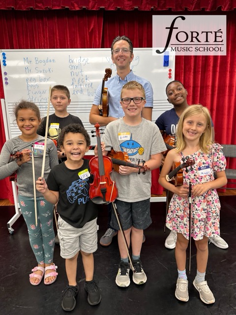 A group of children holding intruments.