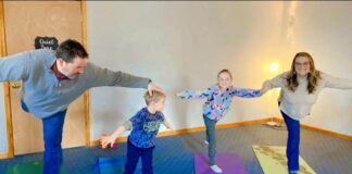 Family doing yoga together at BeLove Parenting class