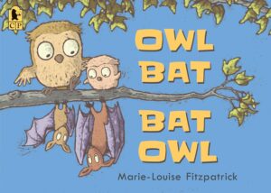 Bats and owls hanging on a tree branch on book cover