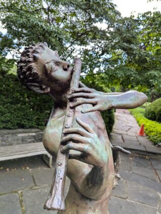 Statue playing flute