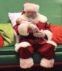 Santa holding baby