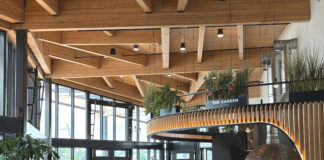 Interior of restaurant with wood design and windows