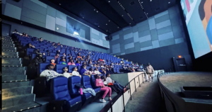 Movie theater with kids in it 