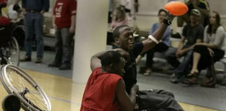 Men in wheelchairs playing basketball