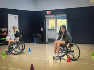 People in wheelchairs in gym
