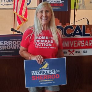 woman holding campaign sign
