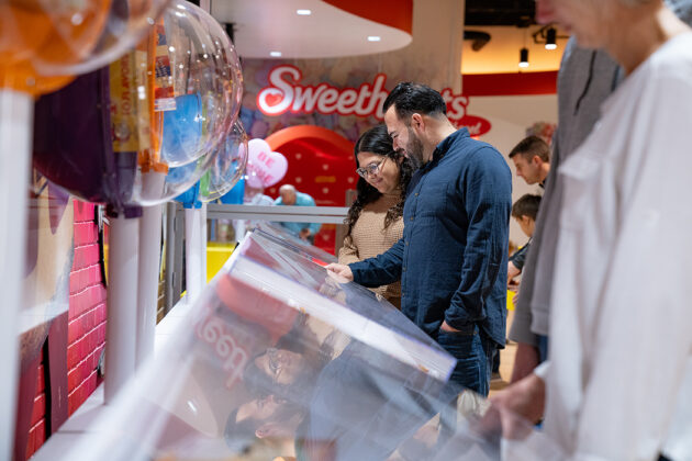 People looking at display case
