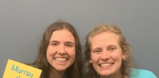 2 women holding books