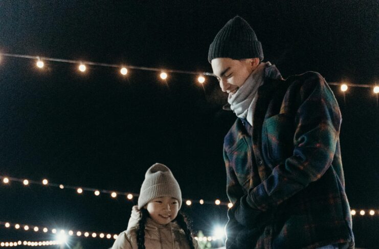 Photo of ice skating dad and daughter