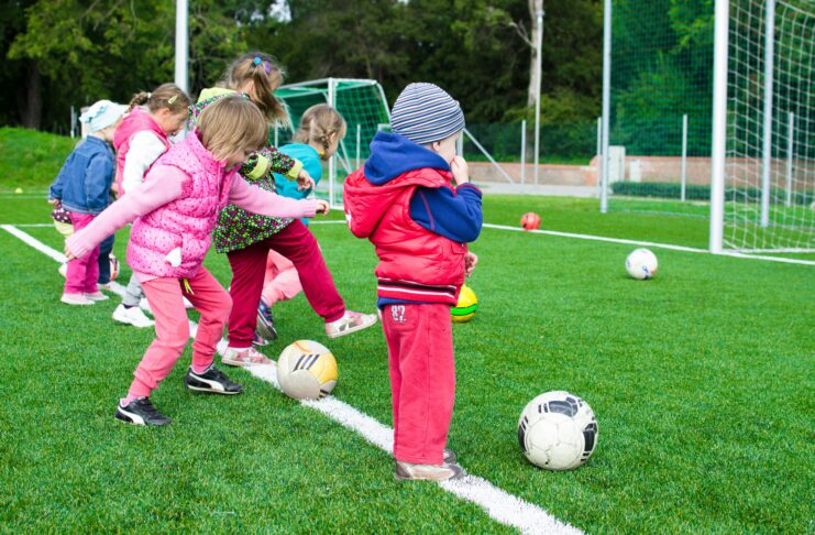 Photos of kids lining up to shoot soccer ball