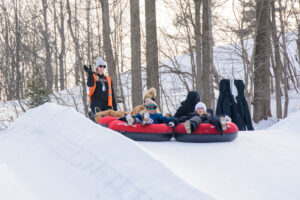 Family tubing in snow