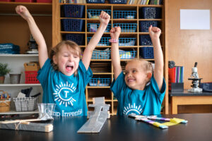 Kids cheering doing science