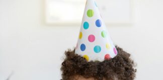 Kid blowing out candles